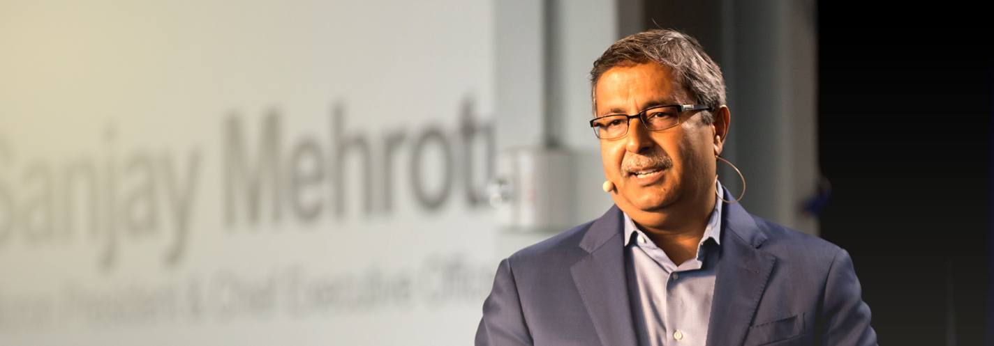 Sanjay Mehrotra talking on stage