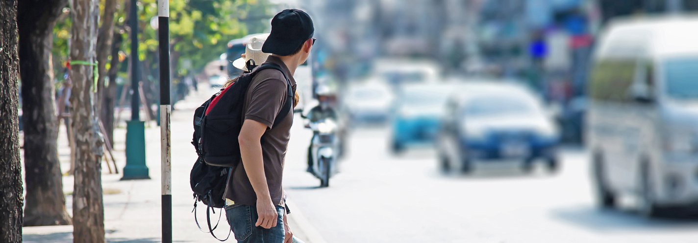 Pedestrian looking for vehicles before crossing  