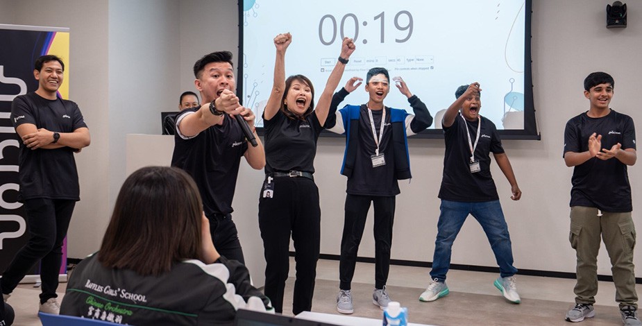 group of people look happy and cheering with a timer running in the background on the screen