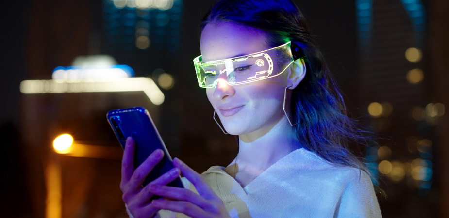 Woman looking at phone with VR goggles