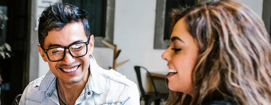 Hispanic Heritage Month: Four Hispanic employees having a conversation in the office
