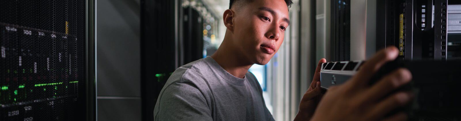 A man looking at a device in the lab
