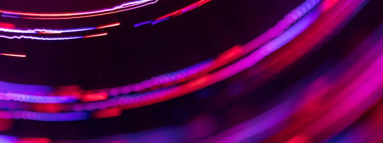 Abstract spinning multi colored lines with blurred motion effect.