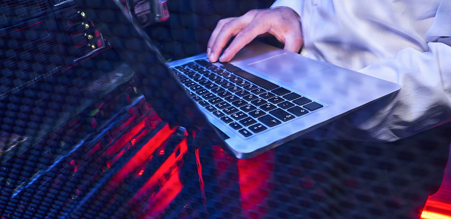Hand on laptop